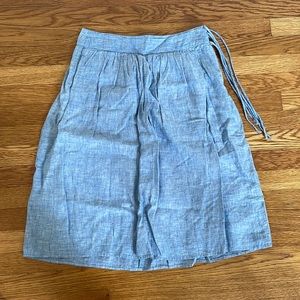 J Crew chambray knee length skirt. High waisted with side zip and cute tassels